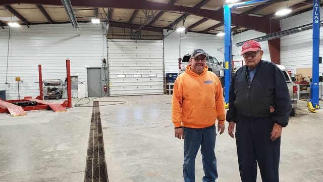 Kurt Condon and his father, Vern stand in the workshop of their new station located at the corner of 8th and Cedar Streets in Boone, Iowa. | Photo by Logan Kahler
