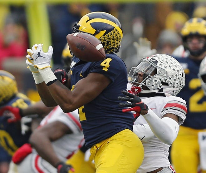 Ohio State cornerback Jeff Okudah breaks up a pass intended for Michigan wide receiver Nico Collins during the first quarter of the Buckeyes' 56-27 win Saturday. [Kyle Robertson/Dispatch]