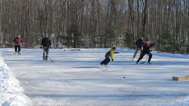Hockey players practice their game at the Mackey Skate Park hockey rink. [Courtesy photo}