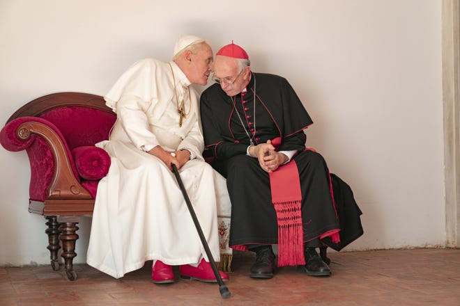 Anthony Hopkins and Jonathan Pryce in "The Two Popes." [Netflix]