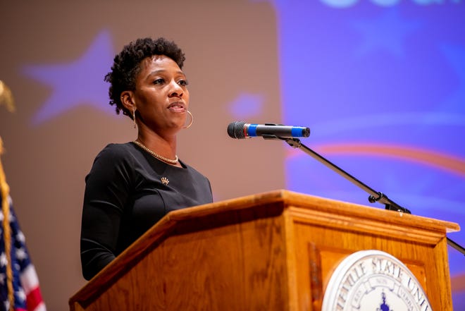 Courtney Banks-McLaughlin speaks Monday at the Fayetteville City Council swearing-in ceremony at Seabrook Auditorium on the campus of Fayetteville State University. She was one of four new council members elected in November. [Raul F. Rubiera/The Fayetteville Observer]