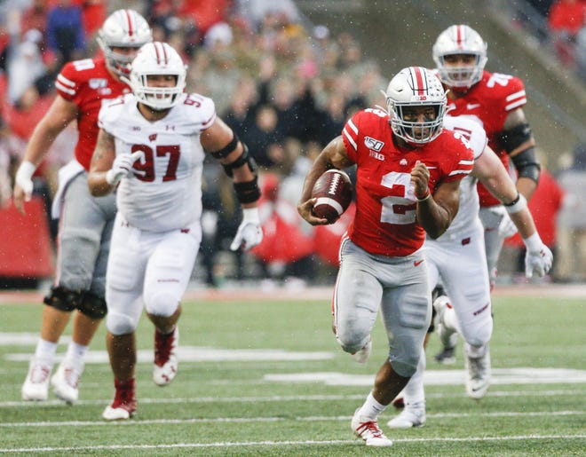 Ohio State Buckeyes running back J.K. Dobbins (2) runs the ball on a 34-yard run during the third quarter of a NCAA Division I college football game between the Ohio State Buckeyes and the Wisconsin Badgers on Saturday, October 26, 2019 at Ohio Stadium in Columbus, Ohio. [Joshua A. Bickel/Dispatch]