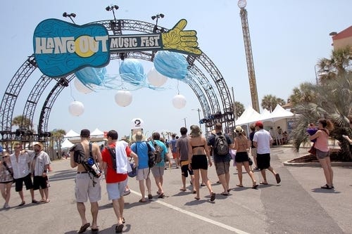 Festivalgoers arrive for the Hangout Music Festival in Gulf Shores on May 20, 2011. [AP Photo/Mobile Press-Register, Kate Mercer/File]