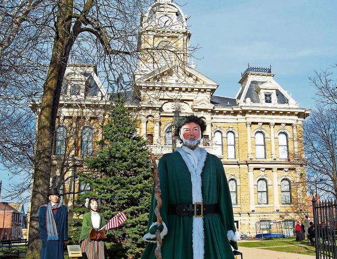 A Dickens Victorian Village display featuring Father Christmas outside the courthouse in Cambridge, Ohio. [CR RAE]