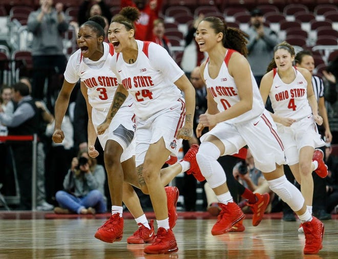 The Ohio State Buckeyes charge back to meet their teammates to celebrate after defeating the #2 ranked Louisville Cardinals at Value City Arena in Columbus, Ohio on Thursday, Dec. 5, 2019. [Maddie Schroeder/Dispatch]