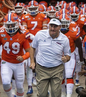 Florida Gators head coach Dan Mullen leads his team out of the tunnel. University of Florida Gators defeated Towson University 38-0 Saturday September 28, 2019 at Ben Hill Griffin Stadium in Gainesville, FL. [Doug Engle/Gainesville Sun]2019