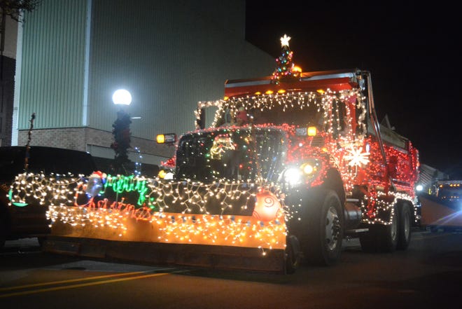 A decorated city of Adrian truck rolls through downtown during the Holiday Parade of Lights Dec. 7, 2018. This year's parade is at 7 p.m. Friday, Dec. 6. [Telegram file photo by Hannah Warner]
