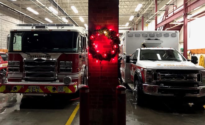 A wreath lighted with red bulbs is hanging outside the Central Fire Station at Fifth and Valley Streets. For each structure fire from Thanksgiving Day to New Year's Day, a bulb is changed to white. [Photo submitted]