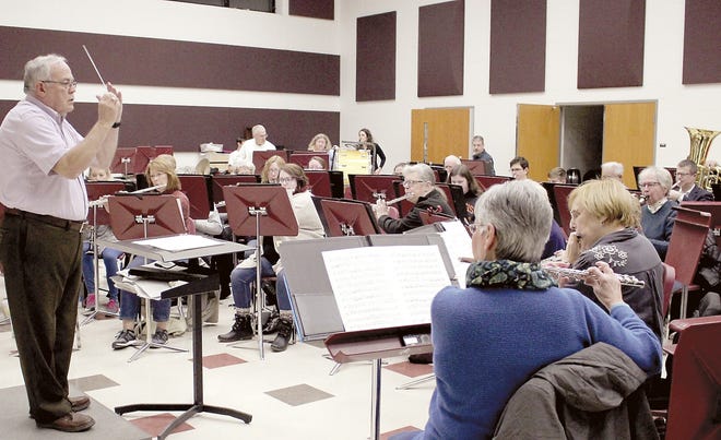 Under the direction of Scott Davidson, members of Sturgis Wind Symphony rehearsed this week for Sunday’s show, “Winds of Christmas.” [Michelle Patrick/Journal]