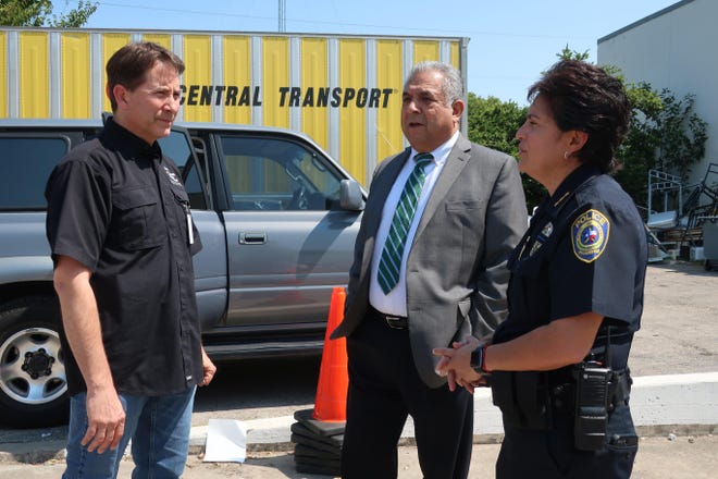 Austin Disaster Relief Network and its founder, Daniel Geraci, left, work with Pflugerville Police Chief Jessica Robledo and Pflugerville Mayor Victor Gonzales as they load supplies to take to Hurricane Harvey-affected areas. Geraci had the idea for the network 10 years ago. [Contributed by Austin Disaster Relief Network 2017]