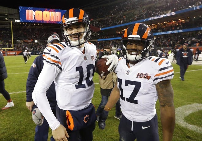 Chicago Bears quarterback Mitchell Trubisky and wide receiver Anthony Miller (17) react following the game against the Dallas Cowboys Thursday in Chicago. Chicago won 31-24. [Morry Gash/The Associated Press]