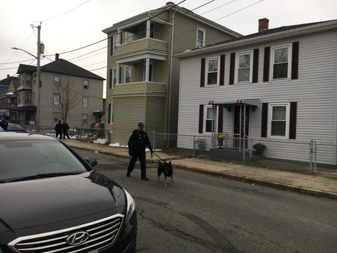 A stabbing in the driveway of this green Murray Street triple-decker sent one man to the hospital Friday. A suspect is in custody, according to police. [Herald News Photo | Jo C. Goode]