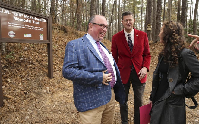 Billy McFarland Jr. laughs with Secretary of State John Merrill and Donica Knight after the ceremony to open the new J.W. "Bill" McFarland, Sr. hiking and biking trail, dedicated in memory of McFarland's father, at Lake Lurleen State Park in Coker Thursday, Dec. 5, 2019. [Staff Photo/Gary Cosby Jr.]