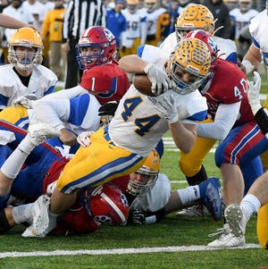 Clyde running back Gunner Golden crosses the goal line for one of his four touchdowns against Licking Valley. [Ray Stewart/The (Canton) Repository]