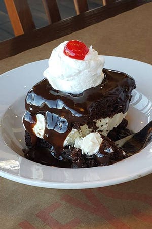 On the menu since the restaurant’s founding in 1947, Shoney’s Hot Fudge Cake features vanilla ice cream sandwiched between freshly baked layers of chocolate cake, covered in hot fudge sauce, whipped topping and a cherry. Shoney’s serves over 2 million Hot Fudge Cakes each and every year. (Courtesy photo)