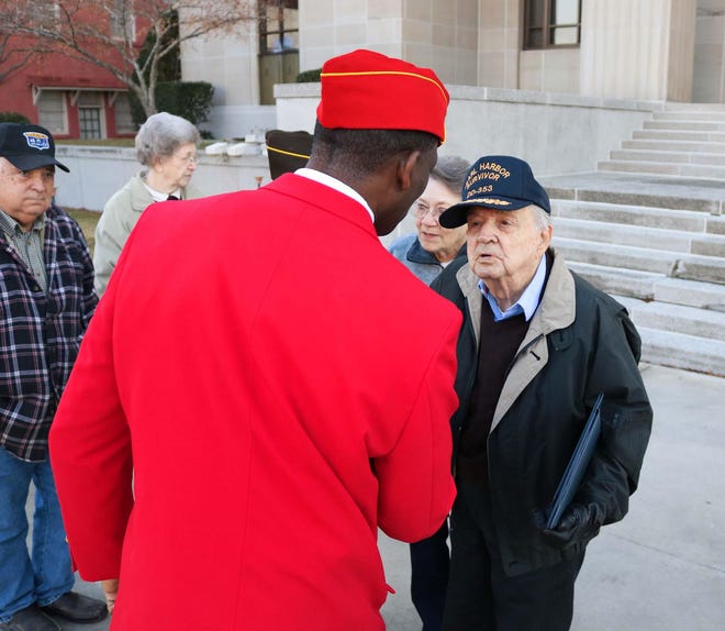J.L. Wilson shakes hands with a local veteran Saturday, Dec. 7, at the Lenoir County Courthouse on the 78th anniversary of the attack on Pearl Harbor. [Brandon Davis/Kinston Free Press]