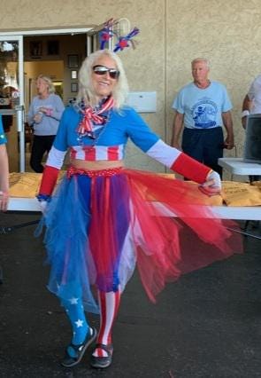 Vickie Woltner, drummer for the Salt Run Flyers, wears the costume she selected to inspire her teammates. It is traditional for the drummer to create a unique team image, and according to legend, the costume should scare the fish. (Contributed photo)
