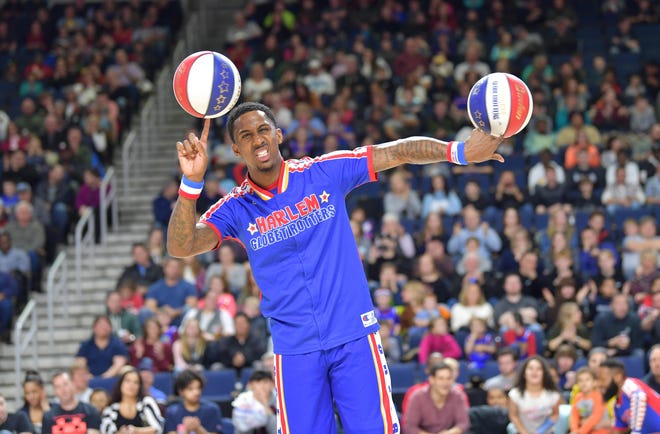 Bull Bullard balances two basketballs in Duluth, Georgia, at a game against the Washington Generals. The Harlem Globetrotters, including Bullard, are bringing their Pushing the Limits World Tour to Daytona Beach Wednesday. [Brett D. Meister/Provided]