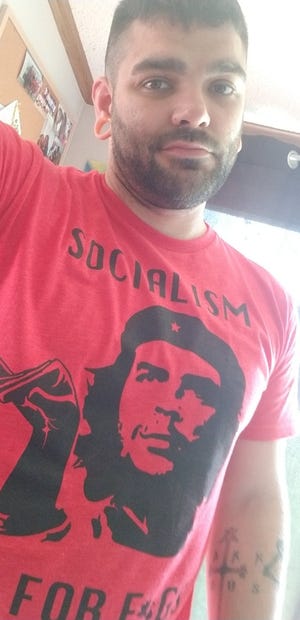 Morgan Bolles was recently appointed to the Fennville City Commission. He said his tweets of him wearing a shirt that says, “Socialism is for f*gs” is not homophobic.” [CONTRIBUTED]
