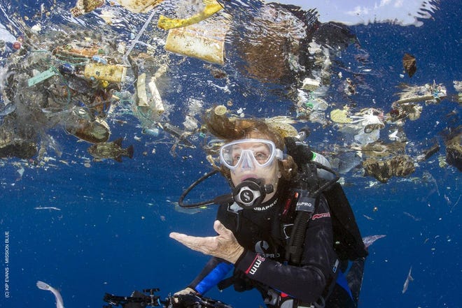 Dr. Sylvia Earle swims amid plastic in Cocos Island, Costa Rica, in the eastern Pacific. [Kip Evans / Mission Blue]