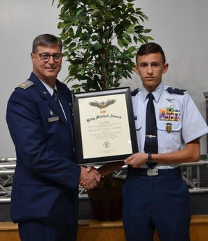 Civil Air Patrol Group One Commander Major Jim Fitzpatrick congratulates Elliot Bishai, a member of the Gastonia Civil Air Patrol. [PROVIDED PHOTO]