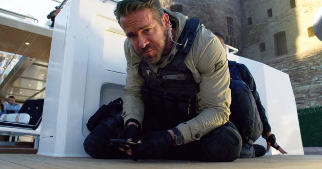 Ryan Reynolds leads a team of operatives in “6 Underground.” [Netflix]