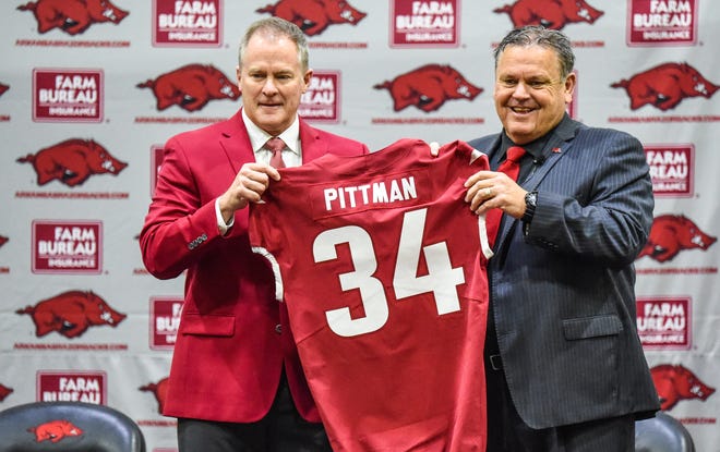 New head football coach Sam Pittman, right, is introduced to Razorback nation by Athletic Director Hunter Yurachek Monday afternoon at the Hogs indoor practice facility. [CW3SportsAction/Craven Whitlow]