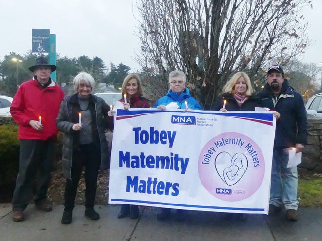 With support from the community and church leaders, nurses at Wareham's Tobey Hospital took part in a candlelight vigil Tuesday evening to protest the pending maternity closure at Tobey Hospital on Dec. 31. Marc Fallon of the Archdiocese of Boston's Labor Guild; a longtime supporter of Tobey, Nancy McFadden; Tobey maternity nurse Joyce Hyslit-Ikkela; retired maternity nurse Lydia Sherman; 16-year Tobey maternity nurse Heather Frink and attorney Richard Staiti, a former selectman and moderator from Canton and a part-time Wareham resident. Staiti said that his parents lived in Wareham and he was "deeply impressed" with the nursing staff "and the tremendous level of care" his mother received as she was dying, some years ago. "It's a wonderful hospital," he said. "I would hate to see this happen."

[Wicked Local Photo/Mary McKenzie]