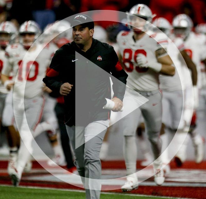 In this file photo Ohio State Buckeyes head coach Ryan Day runs out onto the field at the start of the Big Ten Football Championship Game between the Ohio State Buckeyes and the Wisconsin Badgers on Saturday, December 7, 2019 at Lucas Oil Stadium in Indianapolis, Indiana.