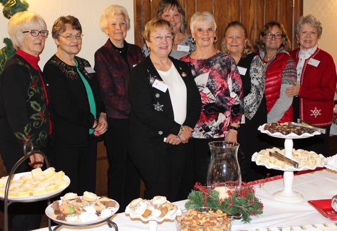The Hospitality Committee for the Hillsdale Garden Club Christmas Tea prepares to serve an array of treats to members and guests. [NANCY HASTINGS PHOTO]