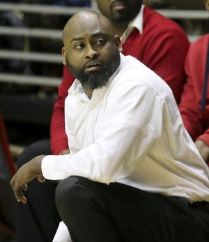 Sumter Central coach Jazmin Mitchell coaches from the bench during the Southwest Regional at the Dunn-Oliver Acadome in Montgomery, Feb. 19, 2019. The Jaguars are ranked No. 2 in Class 4A. [Staff Photo/Gary Cosby Jr.]