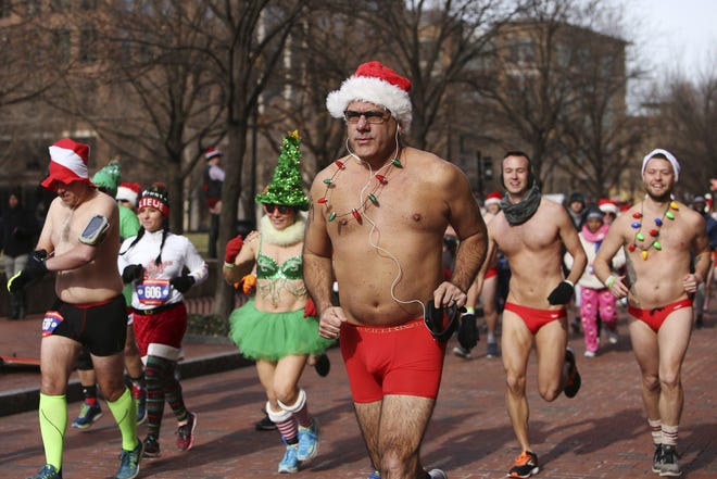 Runners dashing through the cold in the 2018 Santa Speedo Dash for Diabetes. [Dispatch file photo]
