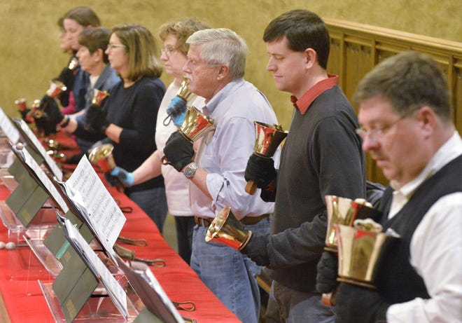 The Covenant Bells rehearse at First Presbyterian Church of the Covenant in Erie last month. Members include, from back left, Laura Cooper, Nancy van den Honert, Nancy Herold, Cindy Kerchoff, Peter van den Honert, Montgomery Service and Atchley Holmes. [GREG WOHLFORD/ERIE TIMES-NEWS]