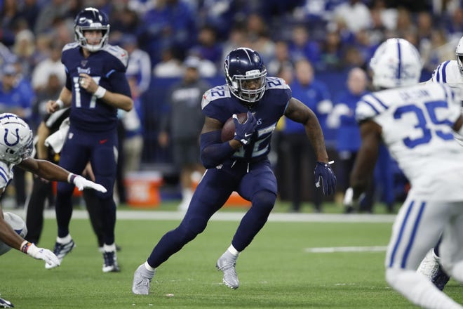 Tennessee Titans running back Derrick Henry (22) runs against the Indianapolis Colts in Indianapolis, Dec. 1. The Titans are tied for the AFC South lead heading into this week’s game against the Houston Texans. [JEFF HAYNES/AP IMAGES FOR PANINI]