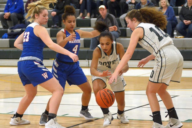 Seniors Aaliyah Djanabia-James, center, and Samantha Romps, right, are two of the leaders on the Dover High School girls basketball team this winter. The Green Wave open Tuesday at Salem. [Fosters/file photo]