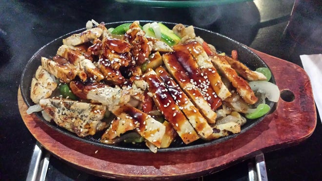 The teriyaki chicken comes out hot and full of flavor. [SHARON DOOLEY/CONTRIBUTING WRITER]