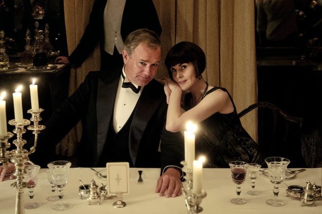 Hugh Bonneville stars as Lord Grantham and Michelle Dockery is Lady Mary in the movie version of "Downton Abbey," being released on DVD Dec. 17. [Focus Features]
