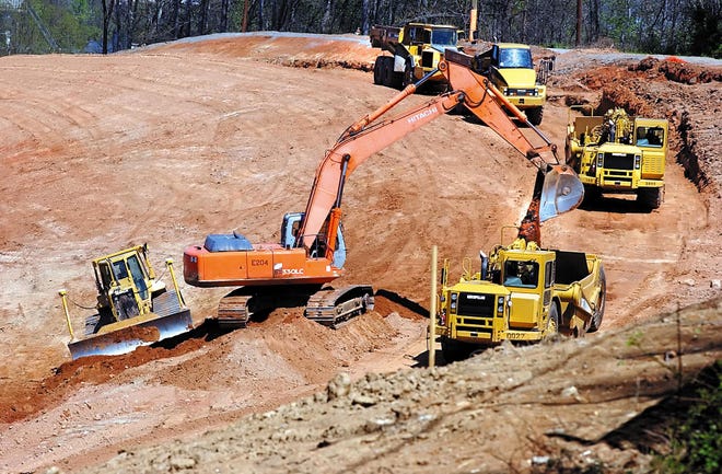 In this file photo from 2008, heavy machinery moves earth for construction of the new Google data center site in Lenoir. [ROBERT REED/HICKORY RECORD]