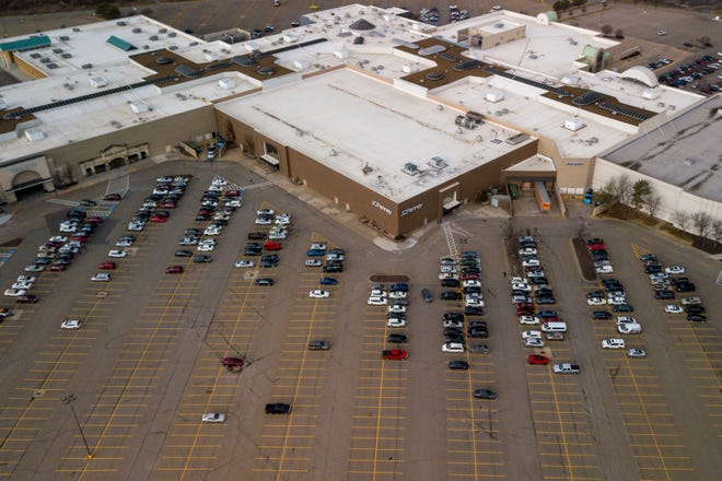 A view of West Ridge Mall from above shows a sparsely filled parking lot Thursday afternoon. Wells Fargo Bank submitted the high bid for the property involved at a public foreclosure auction Tuesday. [Evert Nelson/The Capital-Journal]