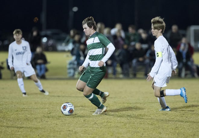 Mosley’s Jakub Reid dribbles the ball up the field during a game against Arnold on Nov. 20. [JOSHUA BOUCHER/THE NEWS HERALD]