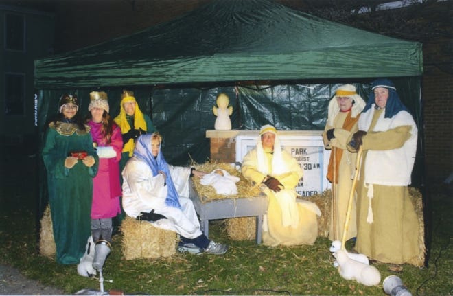 A tradition for over 65 years, South Park United Methodist Church, 600 S. First Ave. in Canton, held their annual live Nativity scene Friday evening, Dec. 6. Many people drove by and honked and wave. Others parked and walked up for a closer look. Also visiting the scene was a man who had participated in the event’s very first year, when he was a teenager. [Submitted photo]