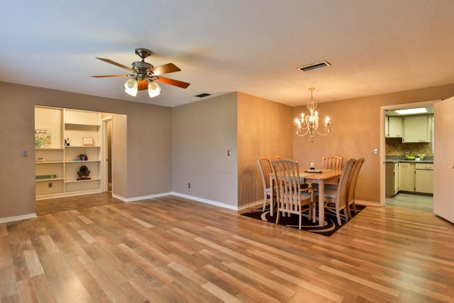 The spacious floor plan includes a living room, family room and a multi-purpose room that measures about 17 by 20 feet and can be used as a den, home office or gym. [Adams, Cameron & Co. Realtors]