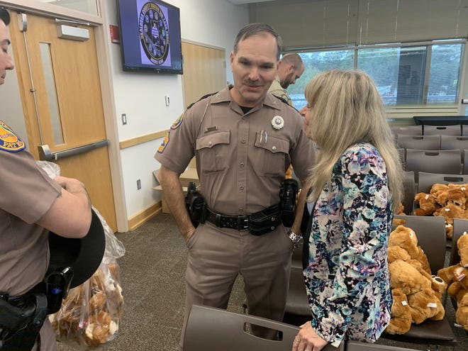 Ron Livingston of the Florida Highway Patrol talks with Mothers Against Drunk Driving’s Amy Jamieson after Friday’s introductory press conference for the Okaloosa County Unified DUI Task Force at Northwest Florida State College. [TONY ADAME/DAILY NEWS]
