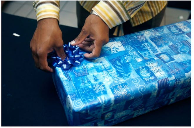Family Service of Rhode Island will be able to wrap enough gifts this year, thanks to the generosity of donors. [The Providence Journal, file / Kris Craig]