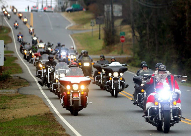 Santa leads the way to Aaron's House during the the Windjammers' toy run in 2016. [Brittany Randolph/The Star]