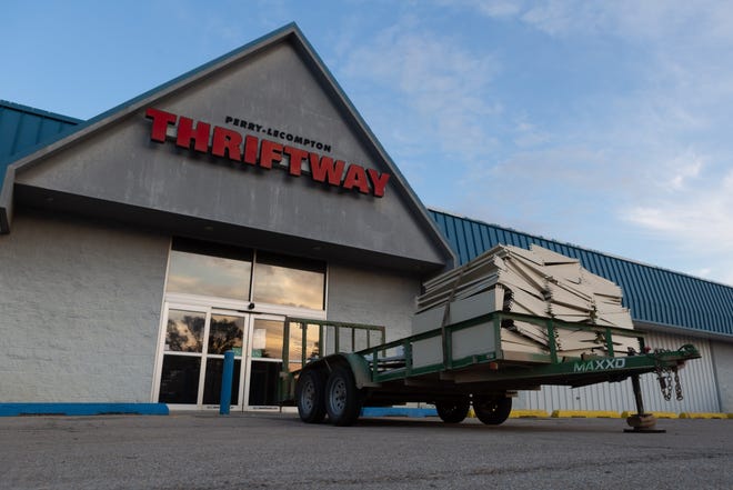 A trailer filled with building material sits in front of the former Perry-Lecompton Thriftway. The grocery store, 609 Cedar St. in Perry, closed in December 2018. [Evert Nelson/The Capital-Journal]