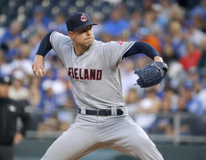 Cleveland Indians starting pitcher Corey Kluber throws during the first inning of a baseball game against the Kansas City Royals on Saturday, Sept. 29, 2018, in Kansas City, Mo. (AP Photo/Charlie Riedel)