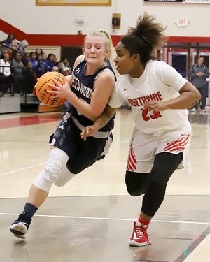 Greenwood's Kinley Fisher pushes the ball to the paint past Northside's Jalyn Ford, Saturday, Dec. 14, 2019, during second quarter play in the ToC at Kaundart-Grizzly Field House. [JAMIE MITCHELL/TIMES RECORD]