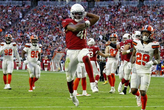 Arizona Cardinals running back Kenyan Drake (41) runs for his fourth touchdown of the game during the second half of an NFL football game against the Cleveland Browns, Sunday, Dec. 15, 2019, in Glendale, Ariz. [Ross D. Franklin/The Associated Press]