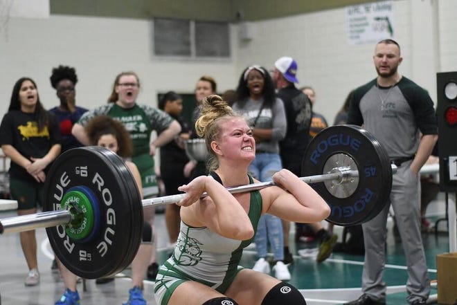 FPC’s Brianna Roth attempts a lift Saturday during the Bulldog Invitational tournament in Bulldog Gym. Roth finished second in the 169 weight class. [News-Tribune/Bob Rollins].